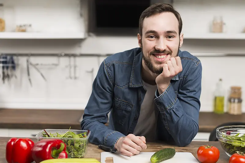 Male smiling in kitchen