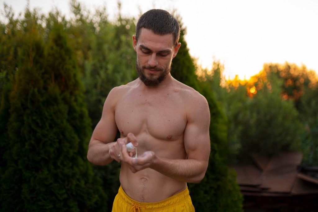 Man applying peptide therapy for muscle growth and recovery