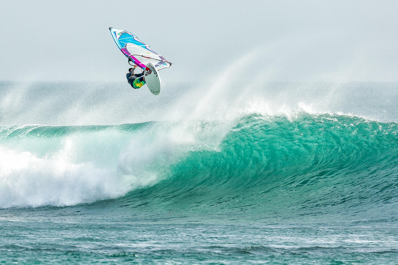 Man Surfing After Platelet-Rich Plasma Injections. He is Seeing the Benefits for Reduced Inflammation and Quality of Life from Past Injuries and More, by PracticeRX Concierge Doctors in Arizona and the USA.